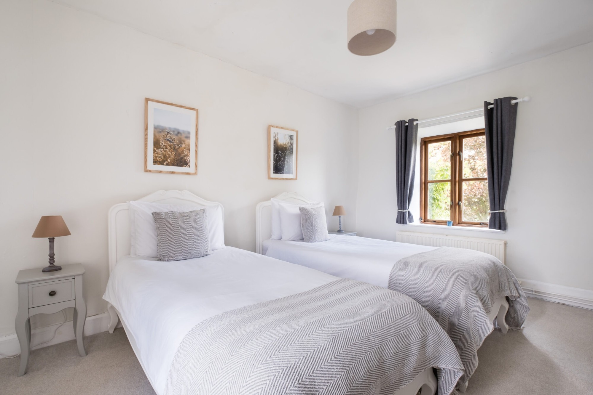 Twin bedroom with two single beds in the main house